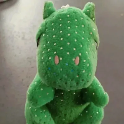 Petite peluche dinosaure vert